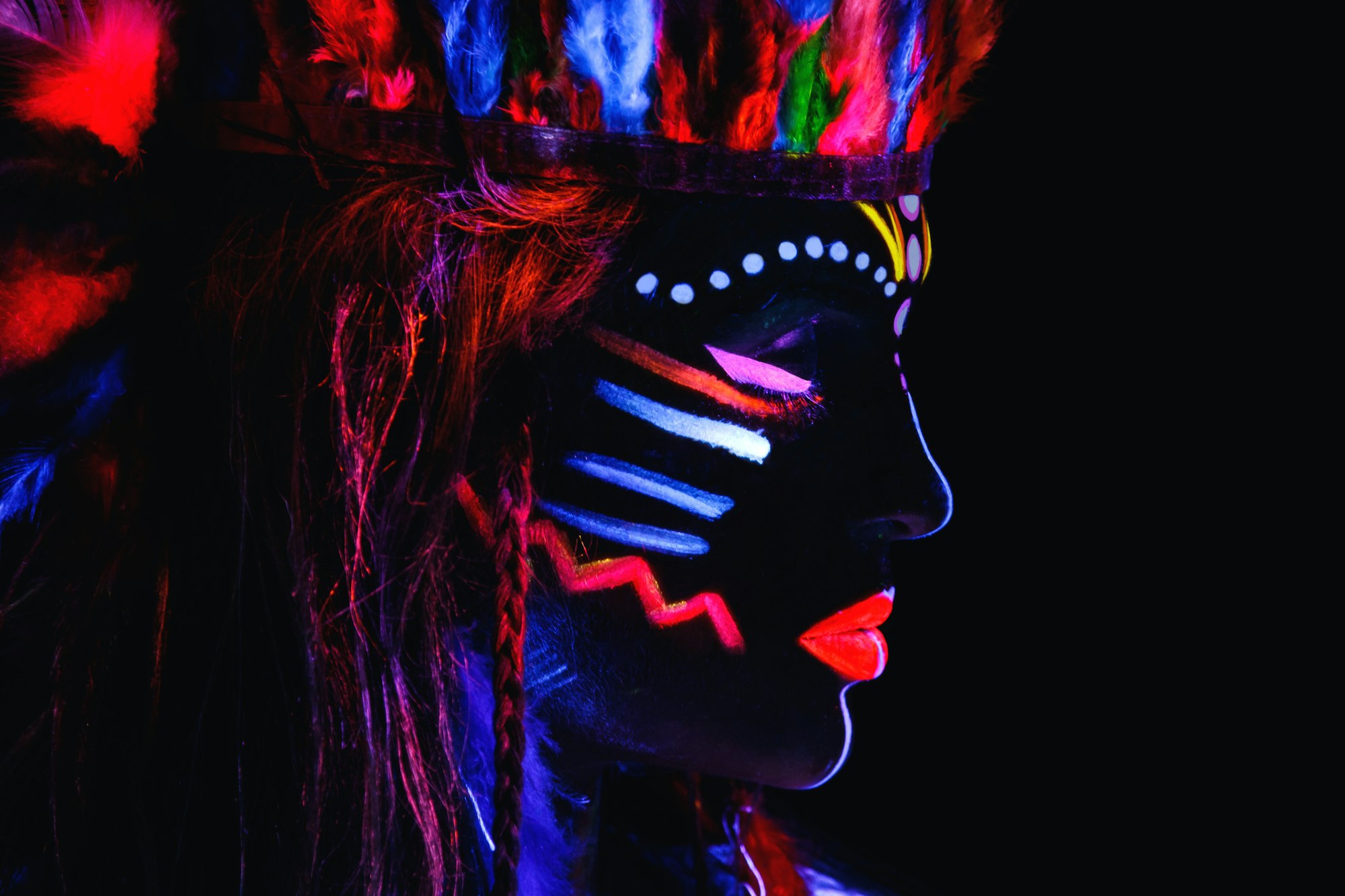 Model in image of Native american with neon makeup