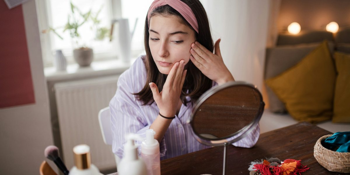 Teenage girl doing her skin care routine.